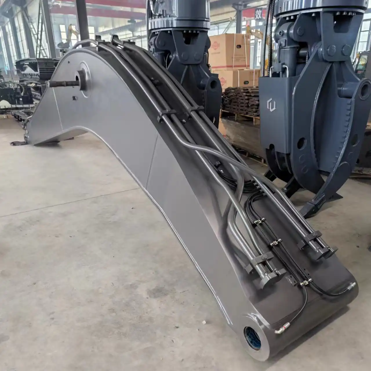 What is the boom and arm on an excavator?